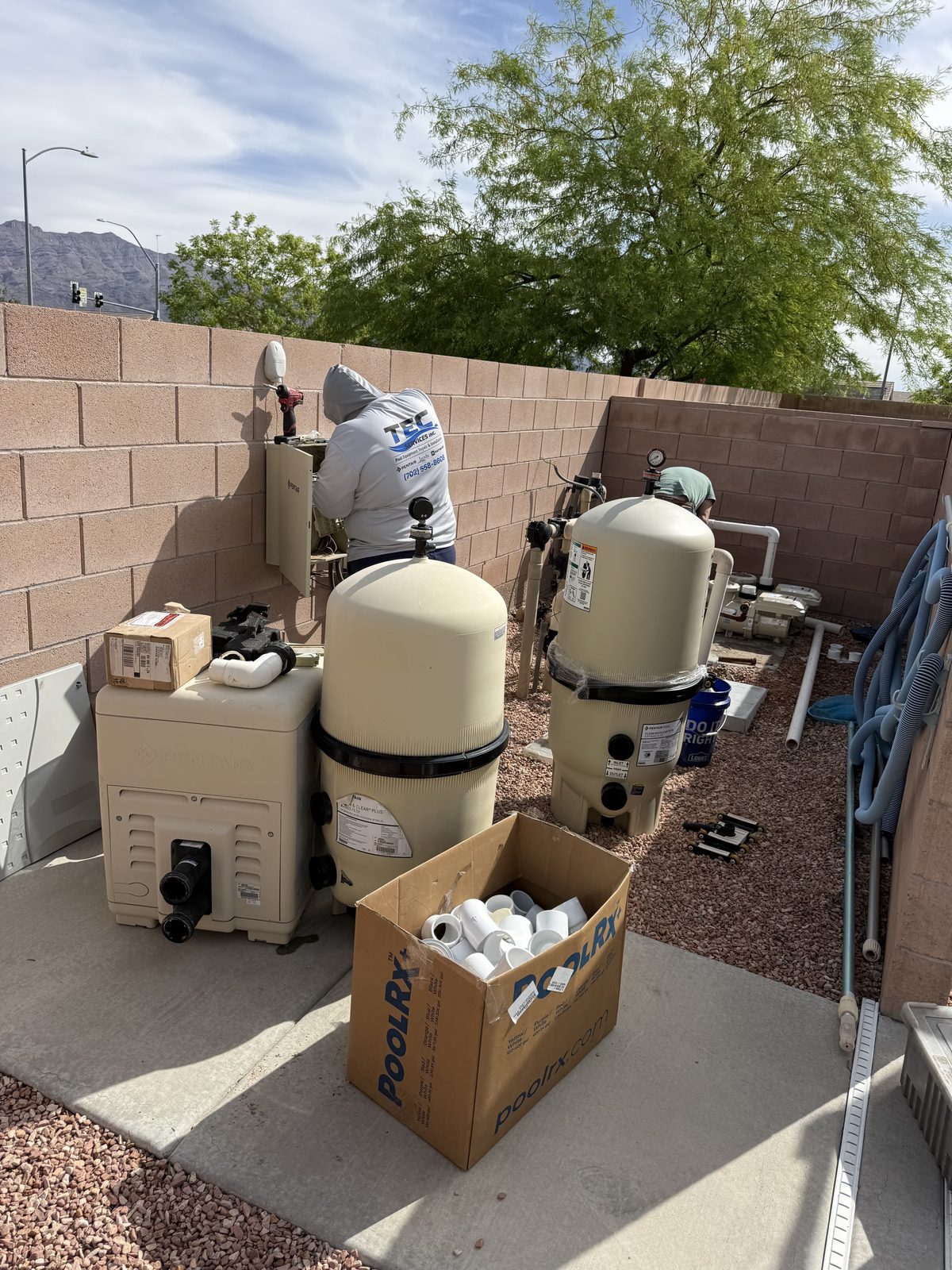 Tec Services crew working on-site pool equipment installation